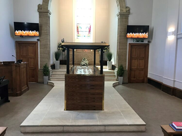 Interior of Honor Oak Crematorium chapel showing thestained glass window and catafalque